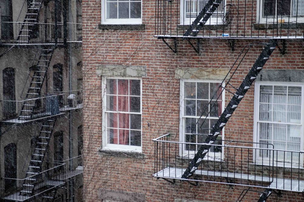 New York rear window view, fire escapes, snow falling